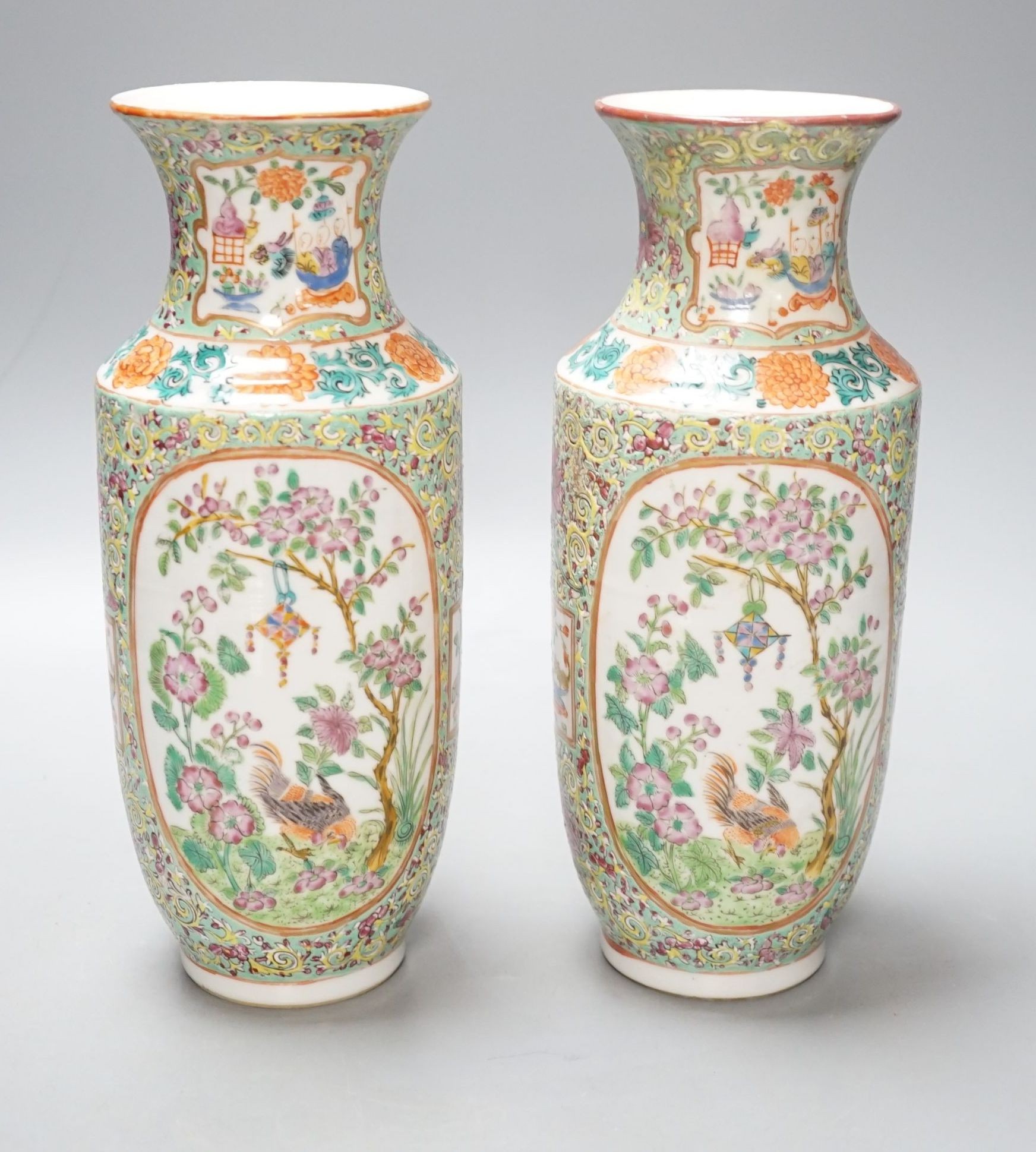 A pair of 19th century Chinese Canton decorated famille rose vases - 25cm tall